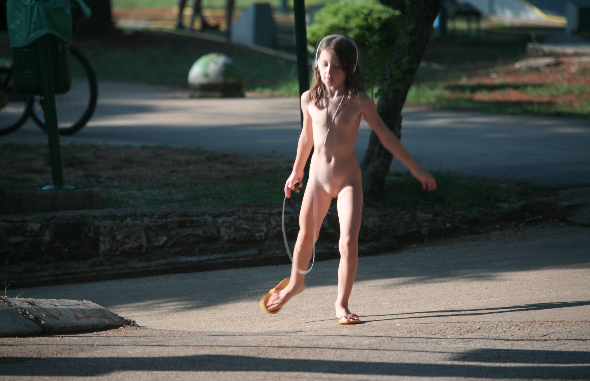 Girl Playing Her MP3 Player - 1