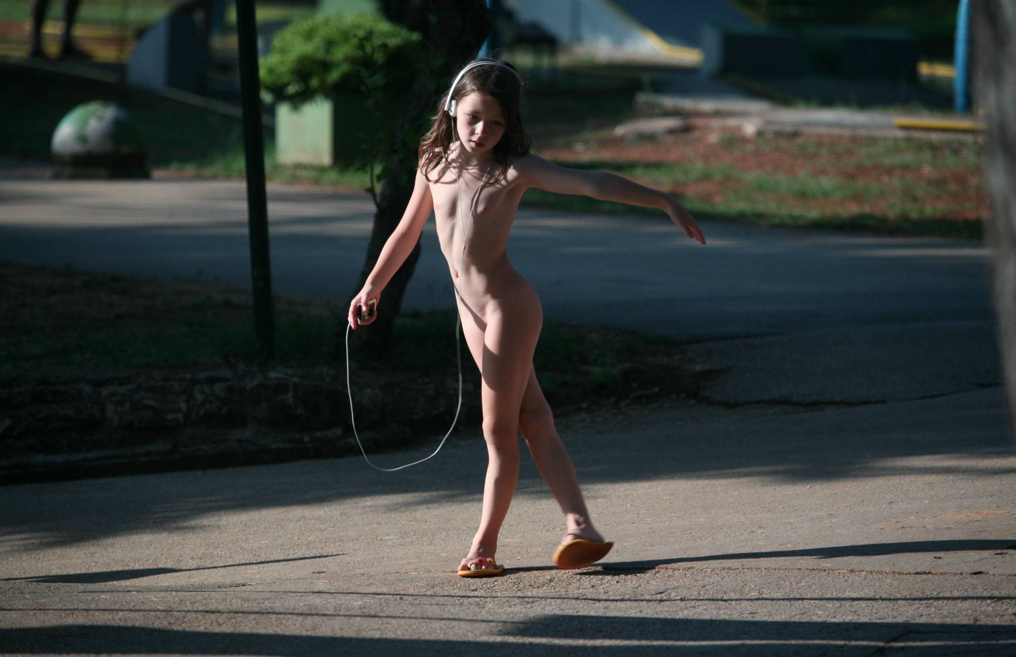Purenudism Pics Girl Playing Her MP3 Player - 2