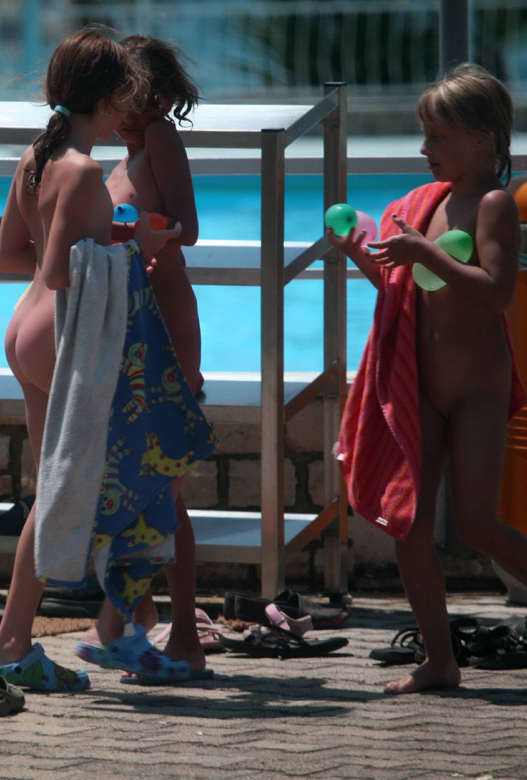 Purenudism Pics Group Huddle By The Pool - 2