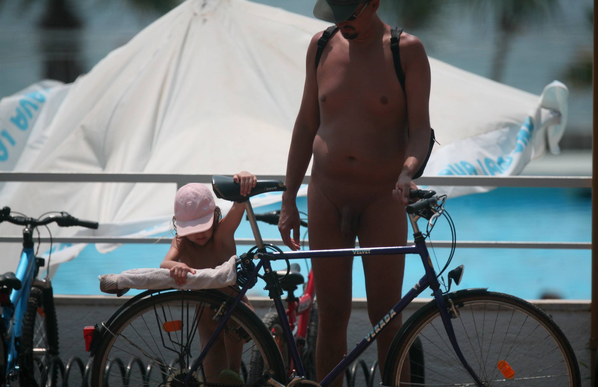 Naturist Pool-Side Bikers - 1