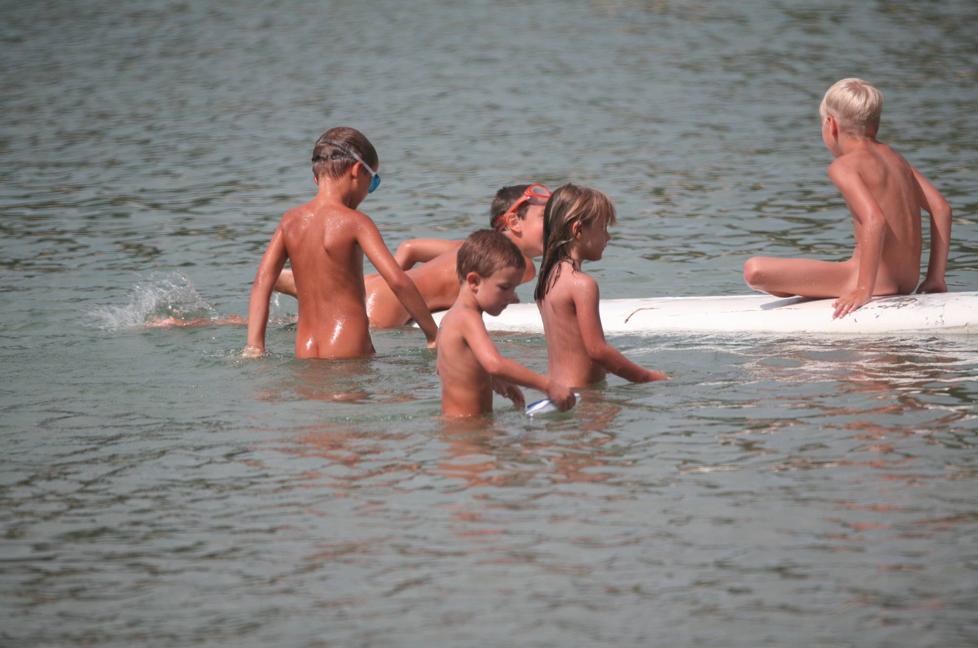 Purenudism Pics Several Kids On Surfboard - 1
