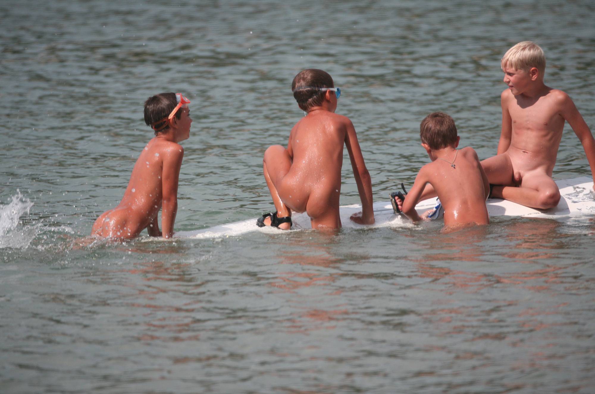 Several Kids On Surfboard - 2